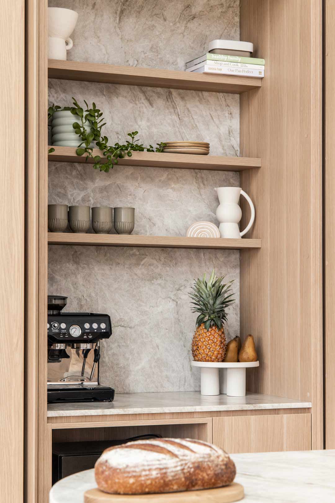 https://www.abiinteriors.com.au/wp-content/uploads/Simple-home-coffee-bar-set-up-seemlessly-intergrated-out-of-the-way-in-the-kitchen-of-modern-coastal-home.jpg